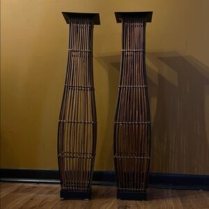 Tall Brown bamboo candle holders.